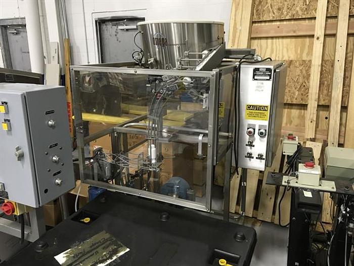 Used Omega model 2DJH bottle unscrambler