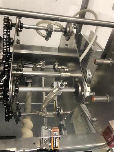 Used Thiele model 34-000 4-Head Rotary Placer with Nordson Hot Melt