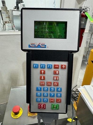 Used CVC model 300 wraparound pressure sensitive labeler with 28" accumulating table