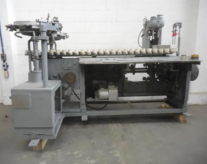 Used Arenco semiautomatic tube filler.