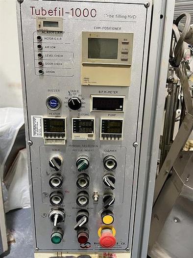 Used Woojung Model Tubefil-1000 Plastic Tube Filler and Sealer