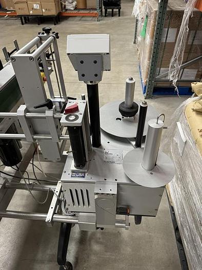 Used Quadrel model Moduline pressure sensitive wraparound labeler