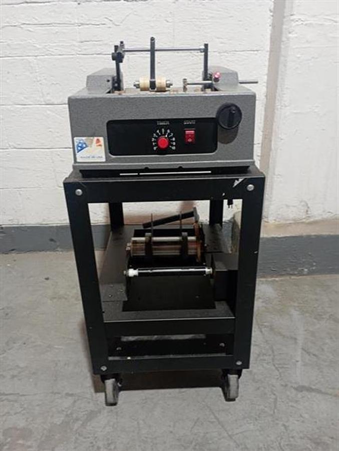 Used Advent model 310 semi-automatic pressure sensitive wraparound labeler