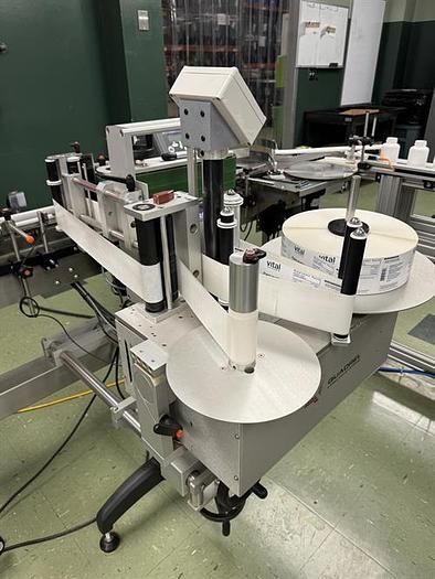 Used Quadrel model Moduline pressure sensitive wraparound labeler