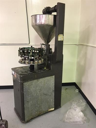 Used Kalix model KX-60 16-Station Tube filler and sealer