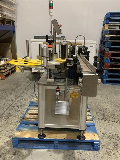 Used Saturn LAWA-A Wraparound Labeler with Accumulating Table