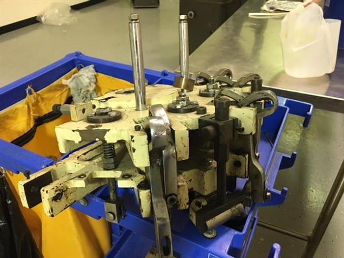 Used Kalix model KX-60 16-Station Tube filler and sealer