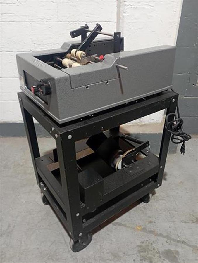 Used Advent model 310 semi-automatic pressure sensitive wraparound labeler