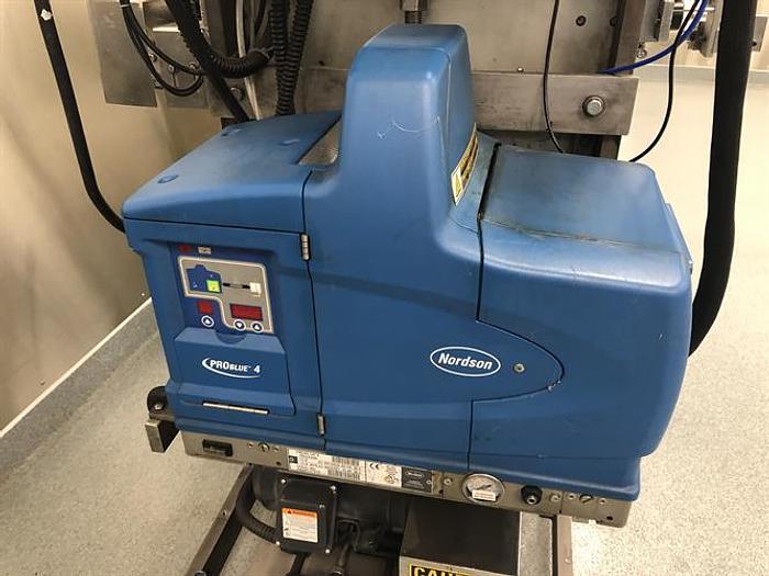 Used Thiele model 34-000 4-Head Rotary Placer with Nordson Hot Melt