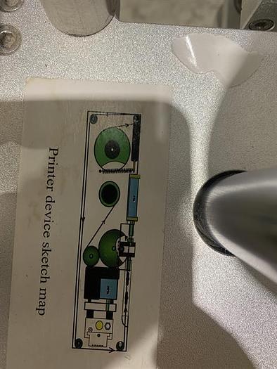 Used Saturn LAWA-A Wraparound Labeler with Accumulating Table