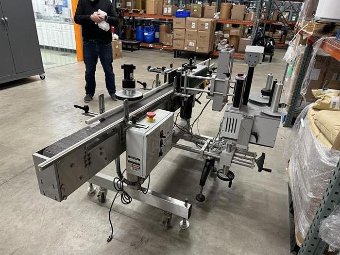 Used Quadrel model Moduline pressure sensitive wraparound labeler