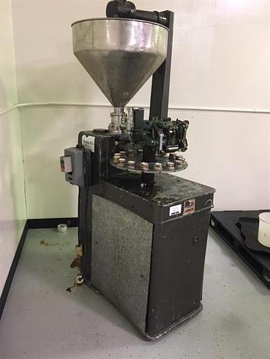 Used Kalix model KX-60 16-Station Tube filler and sealer