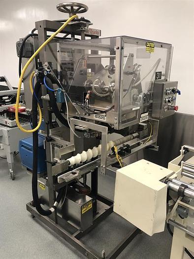 Used Thiele model 34-000 4-Head Rotary Placer with Nordson Hot Melt
