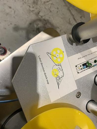 Used Saturn LAWA-A Wraparound Labeler with Accumulating Table