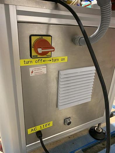 Used Saturn LAWA-A Wraparound Labeler with Accumulating Table