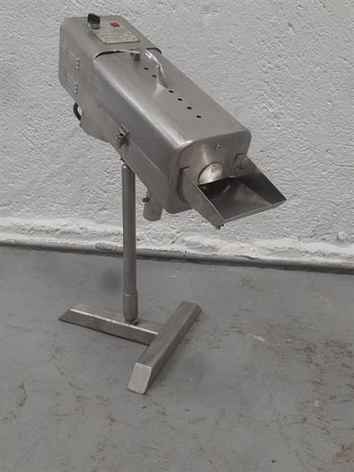 Used BWI Manesty stainless steel table deduster.