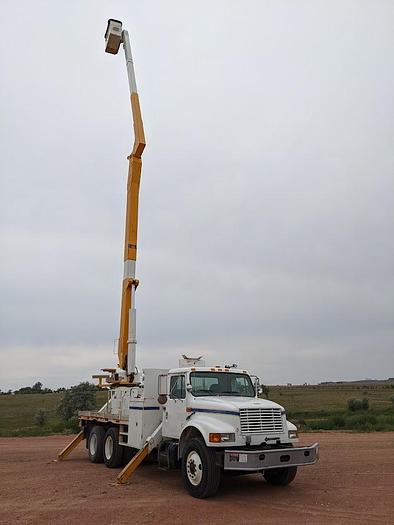 Used 2000 International 4900 Tandem Axle Flatbed Altec A65 70' Articulated Bucket truck