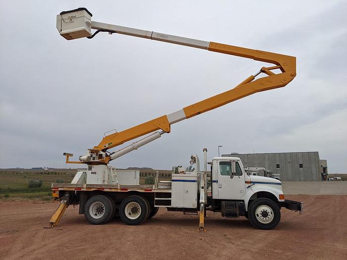 Used 2000 International 4900 Tandem Axle Flatbed Altec A65 70' Articulated Bucket truck
