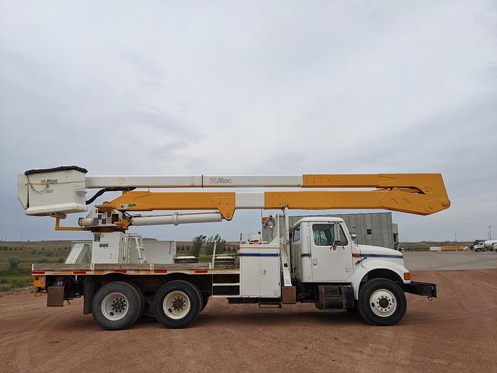 Used 2000 International 4900 Tandem Axle Flatbed Altec A65 70' Articulated Bucket truck