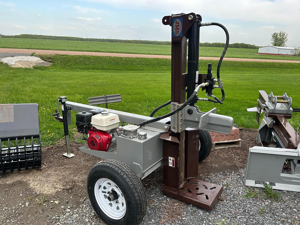A Firewood Splitter or Mini Hoe buckets & attachment