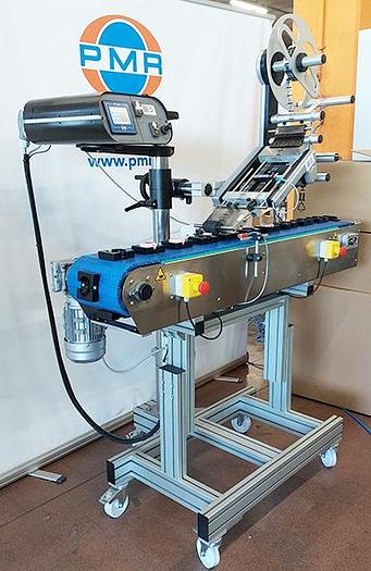 Etichettatrice industriale per applicazione superiore su trousse