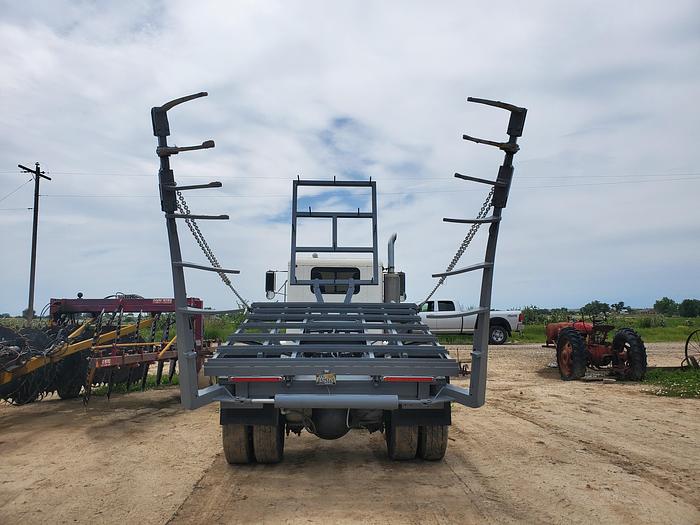 Used 1990 Peterbilt w/ New Holland 1051 Stack Retriever