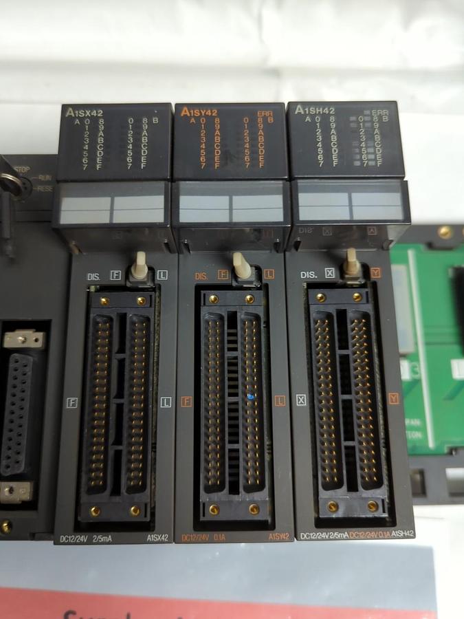 Used MITSUBISHI,A1SJHCPU,MELSEC PROG. CONTROLLER LOGIC/RACK WITH (3) A1SY42 MODULES