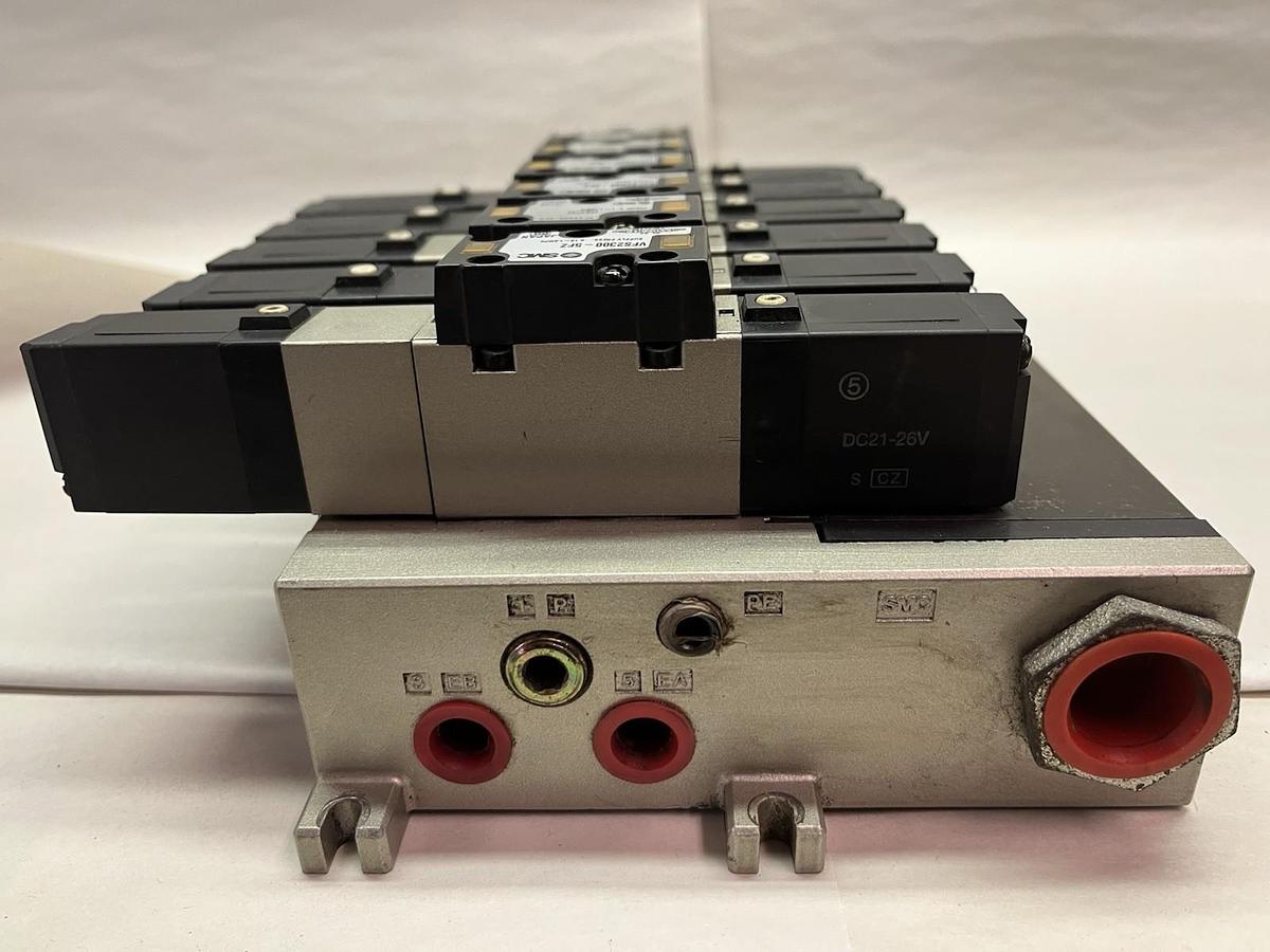 Used SMC,NVFS2200-5FZ,PNEUMATIC VALVE BANK 1/4" NPT W/ 6 SOLENOID VALVES DC 21-26V