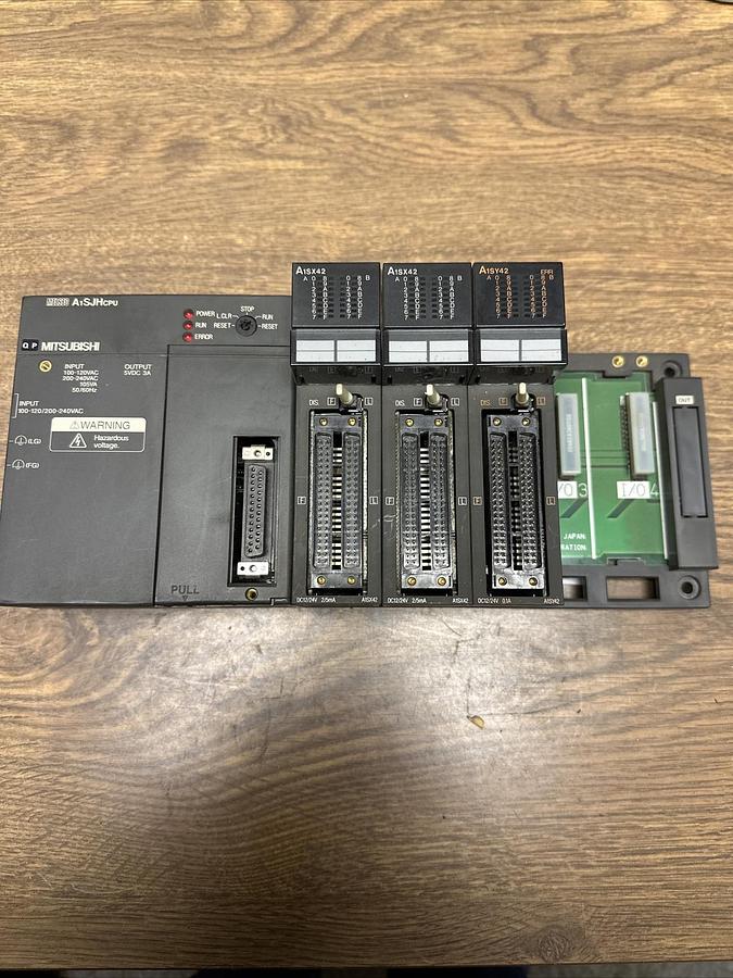 Used Mitsubishi,A1SJHCPU,W/3 A1SY42 Output Modules