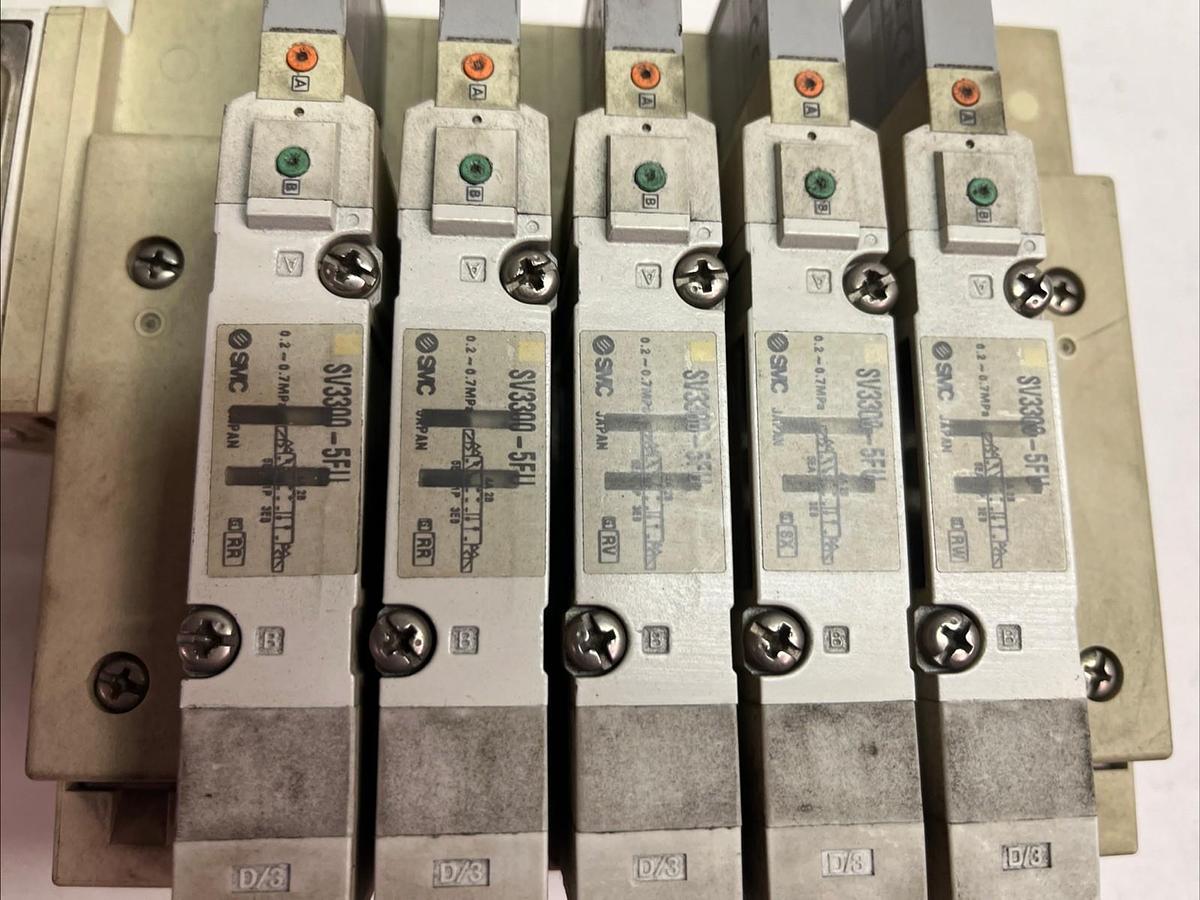 Used SMC,SV3300-5FU,PNEUMATIC AIR VALVE BANK 5 SOLENOID VALVES