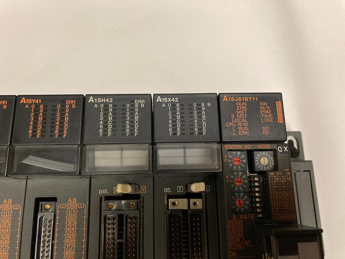 Used Mitsubishi,A1S61PN/A1SY41 (x3) /A1SH42/ A1SX42/A1SJ61BT11,Rack Assembly