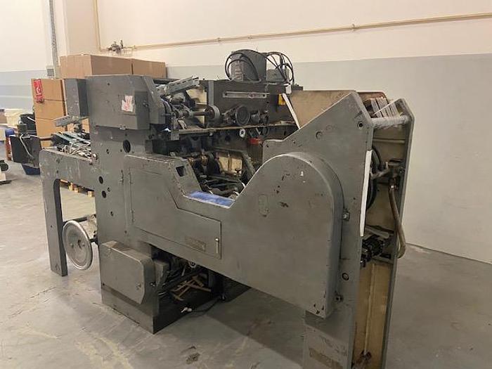 Used (visible in production) 1989 WINDMÖLLER & HÖLSCHER (W&H) T1441 - For making and attaching flat  handles to paper bags