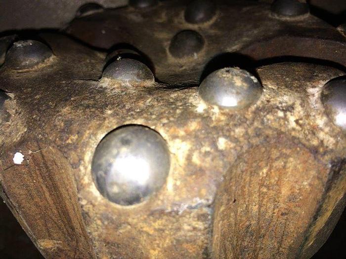 Used HAMMER BIT, SD4 SHANK, 5 1/8" HEAD, CONCAVE FACE, DOMED BUTTONS