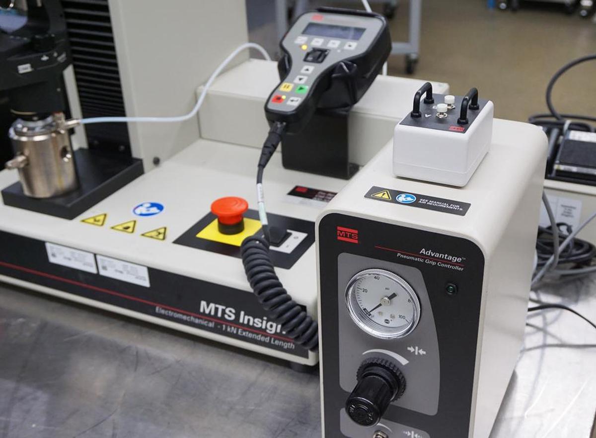 Used MTS Insight 1kN (225lbf) 1EL tensile and compression testing machine with Extended frame, 3 load cells, Pneumatic grips,  and Testworks 4 software