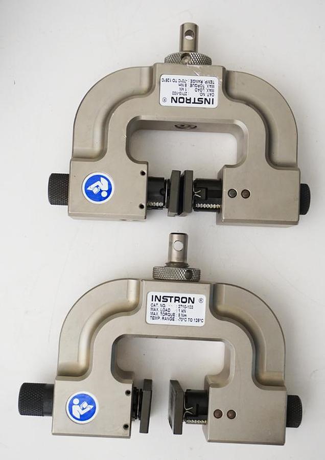 Preowned Instron 2710-103 grips (pair) with 1kN (225lbf) max load and smooth grip faces