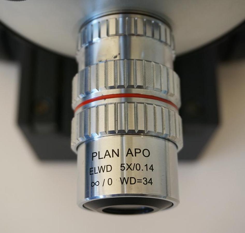 Used Motic PSM1000 probe station microscope with focus block, fiber optic illuminator,  and 2x/5x ELWD objectives