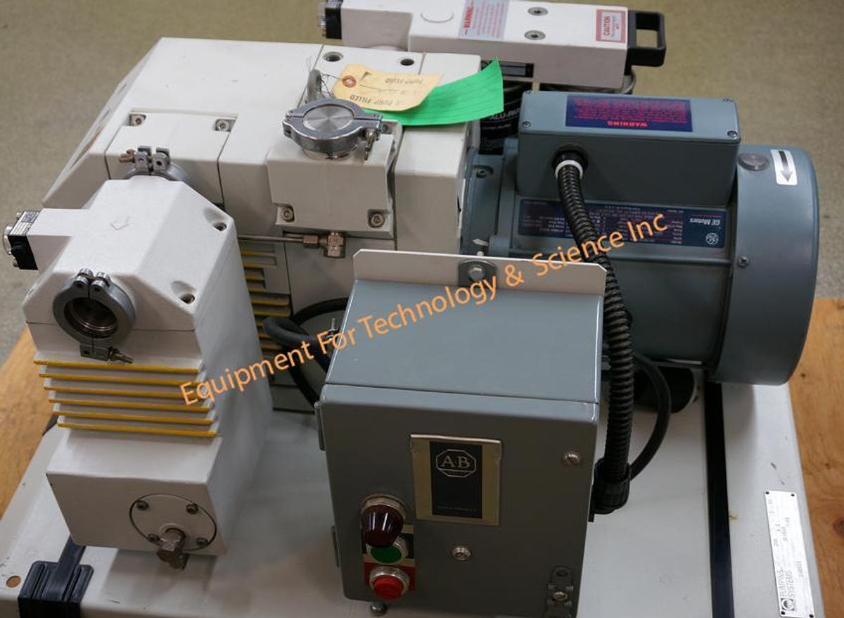 Used Leybold D40BCS 32.5cfm PFPE rotary pump with oil filtration, exhaust filter, control box, base