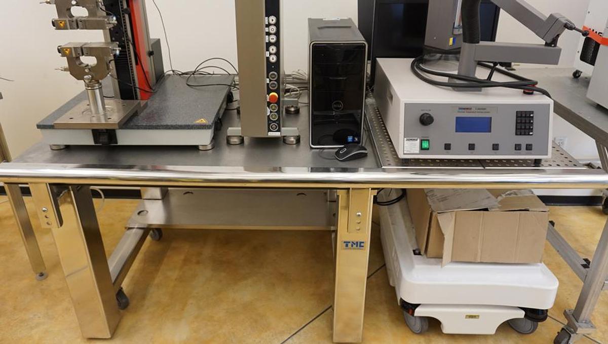 Refurbished TMC 632708801 Stainless Steel Class one vibration isolation table 48"x36" with perforated shelf extension and casters