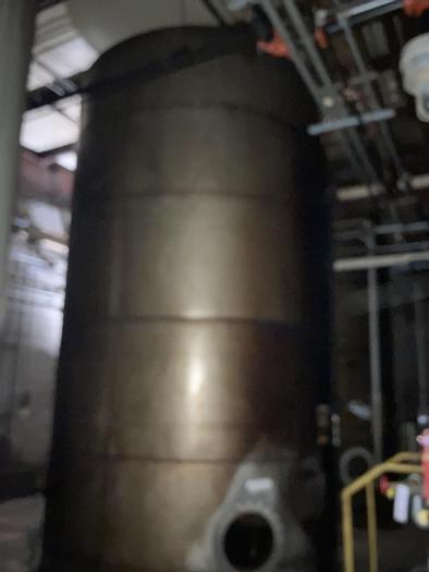 Used Used approximately 11,000 gallon stainless steel vertical tank