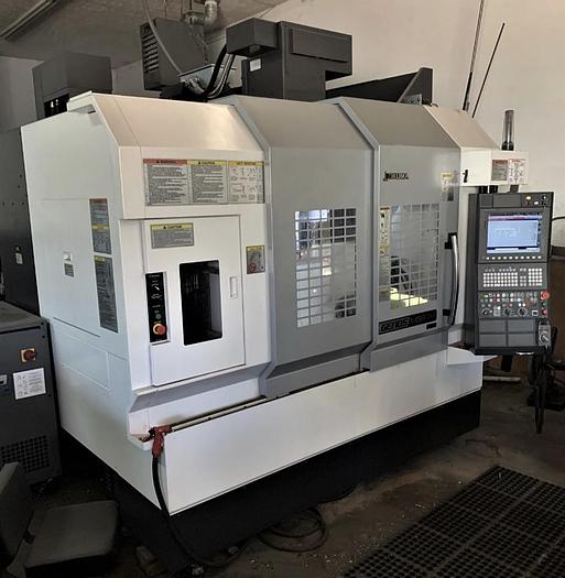 Used 2018 OKUMA GENOS M560-V CNC MACHINING CENTER WITH NIKKEN 10” ROTARY TABLE & CHUCK