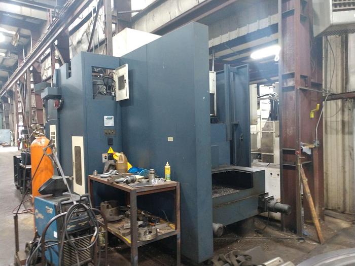 Used 2005 Johnford Bridge Style Vertical Machining Center, Model DCM 2100SH, Table 60" X 86", X Travel 81", Y Travel 72", Z Travel, 31.5", Distance under Rail 37.5", 10,000 RPM, 30HP, ASH A63 tooling, Fanuc CNC.5,