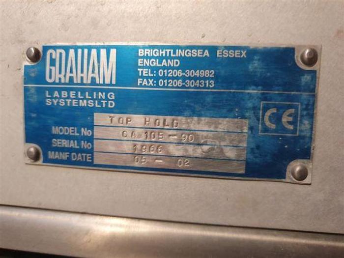 Used 2002 Graham Captain Twin Head Labeller with Top Hold Conveyor