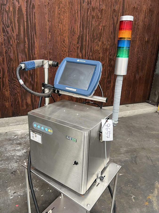 Used Domino model Ax350i inkjet printer with touchscreen controls