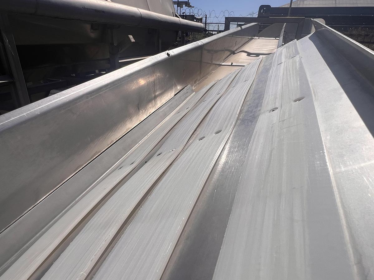 Used 8” wide x 20’ tall stainless steel gooseneck style flighted belt elevator