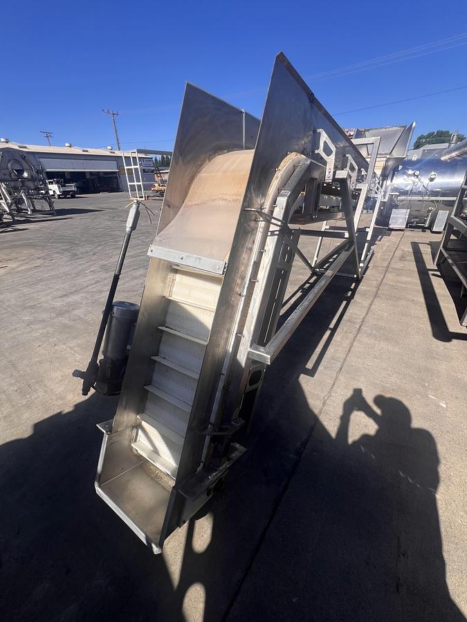 Used 8” wide x 20’ tall stainless steel gooseneck style flighted belt elevator