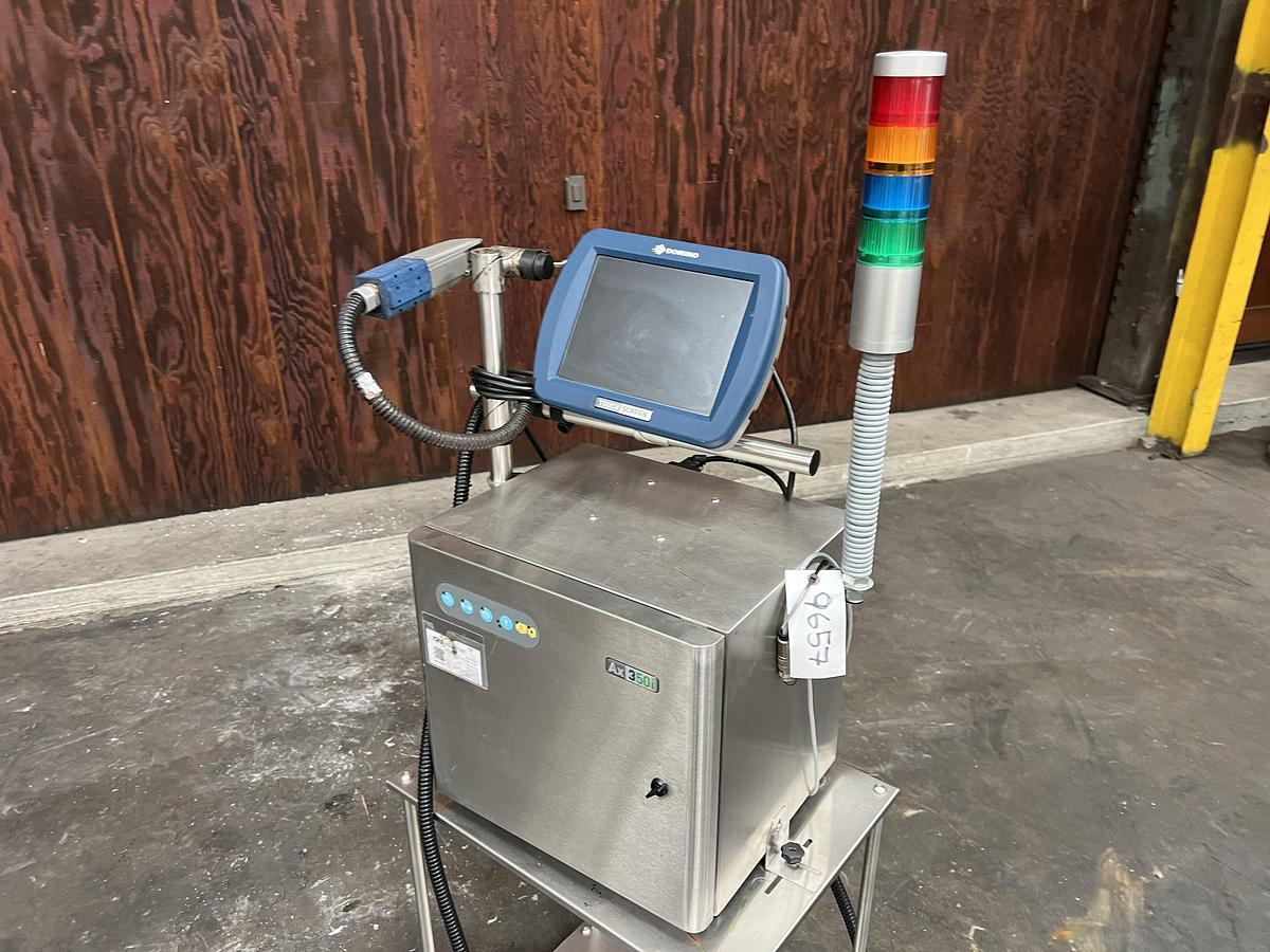 Used Domino model Ax350i inkjet printer with touchscreen controls