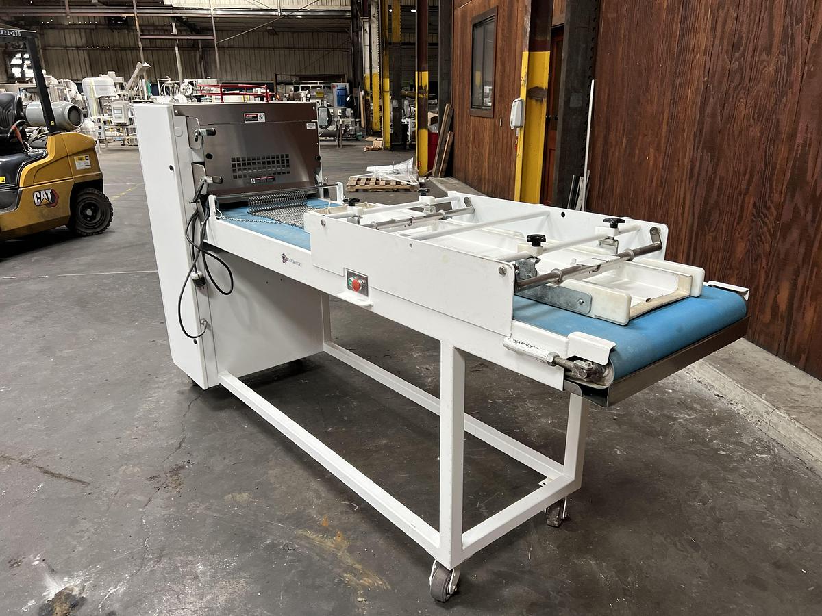 Used Bloemhof model Express 1260 molder and dough sheeter for breads