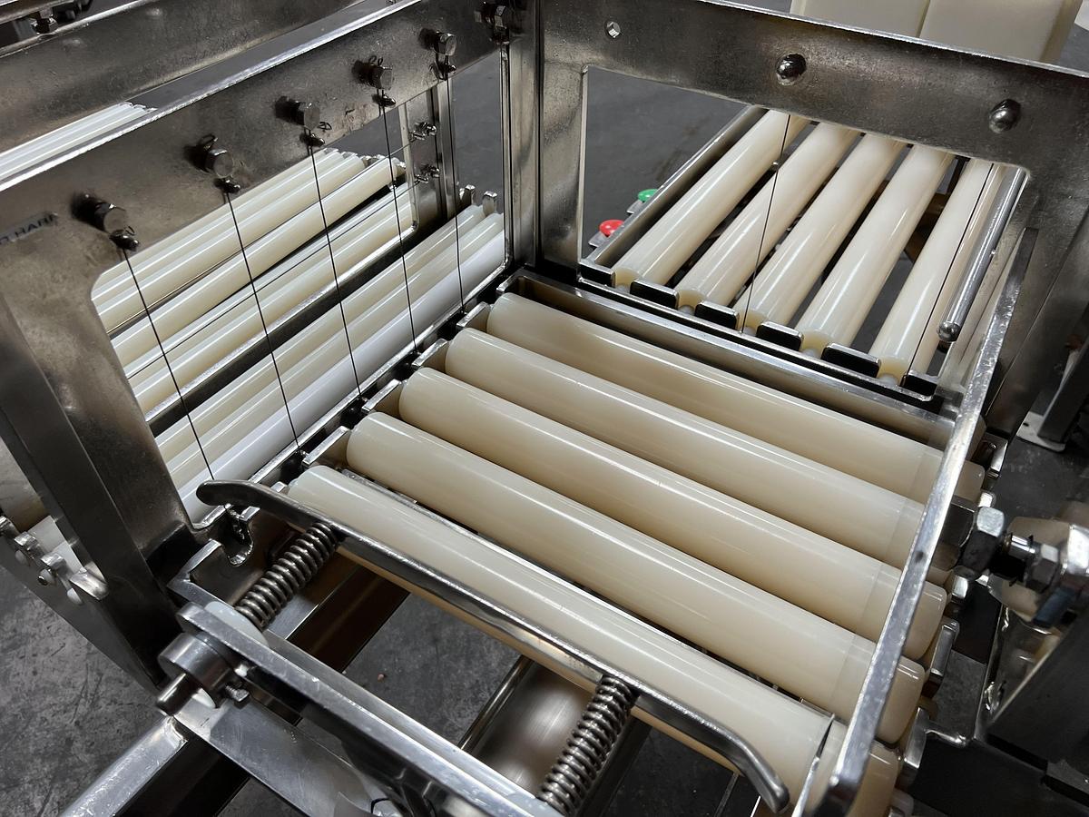 Used Econo Cheese stainless teel two-way pnuematic cheese block cutter