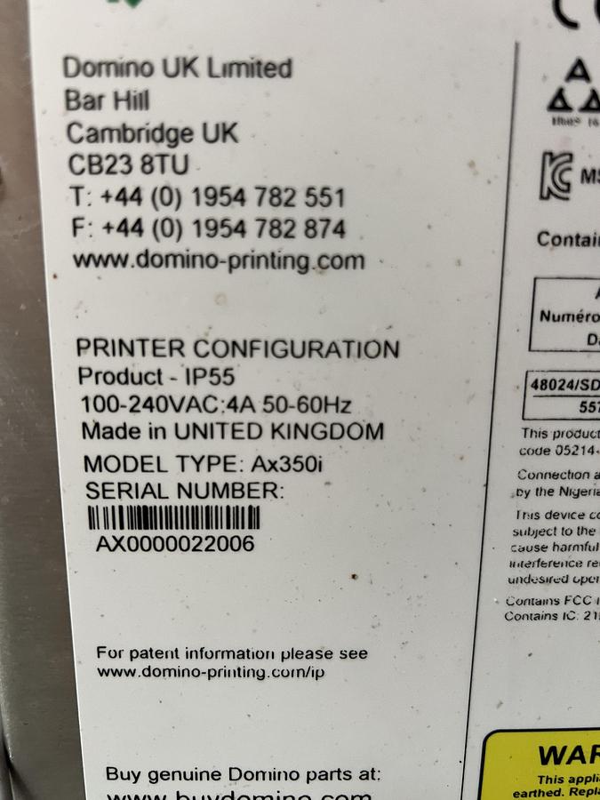 Used Domino model Ax350i inkjet printer with touchscreen controls
