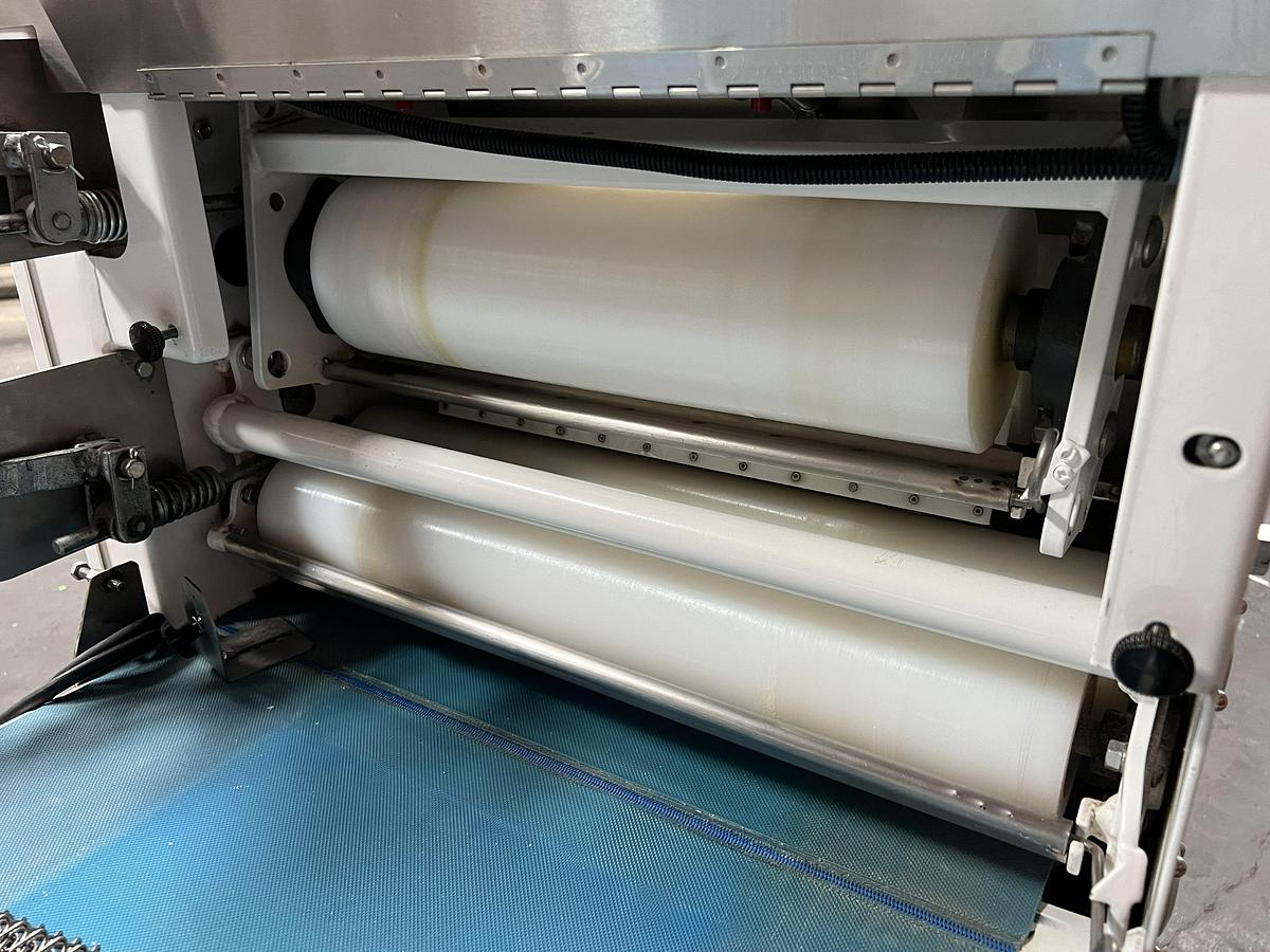 Used Bloemhof model Express 1260 molder and dough sheeter for breads